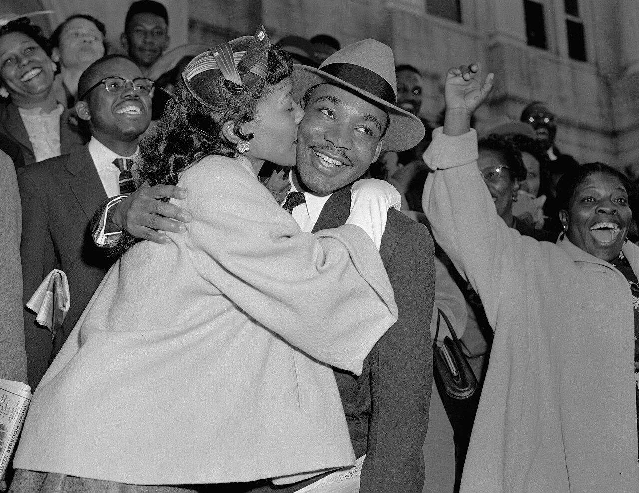 Martin Luther King Jr. is welcomed with a kiss from his wife, Coretta Scott King, after leaving court in Montgomery, AL, on March 22, 1956 — illustrative photo, not partner inventory