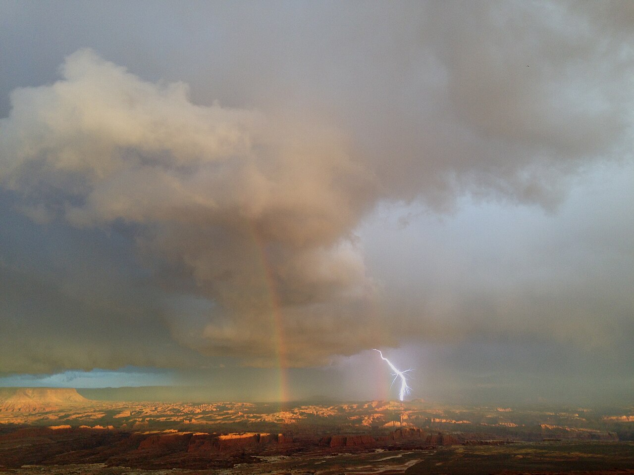 2013-09-22 19 05 29 Rainbow and lightning from a thunderstorm viewed from Grandview Point in Canyonlands National Park, Utah, illustrative photo