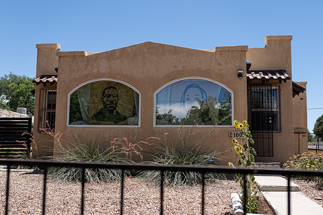 Images of George Floyd and Breonna Taylor are displayed in the front windows of a home in the Silver Hill neighborhood of Albuquerque, New Mexico during July, 2020, illustrative activity photo