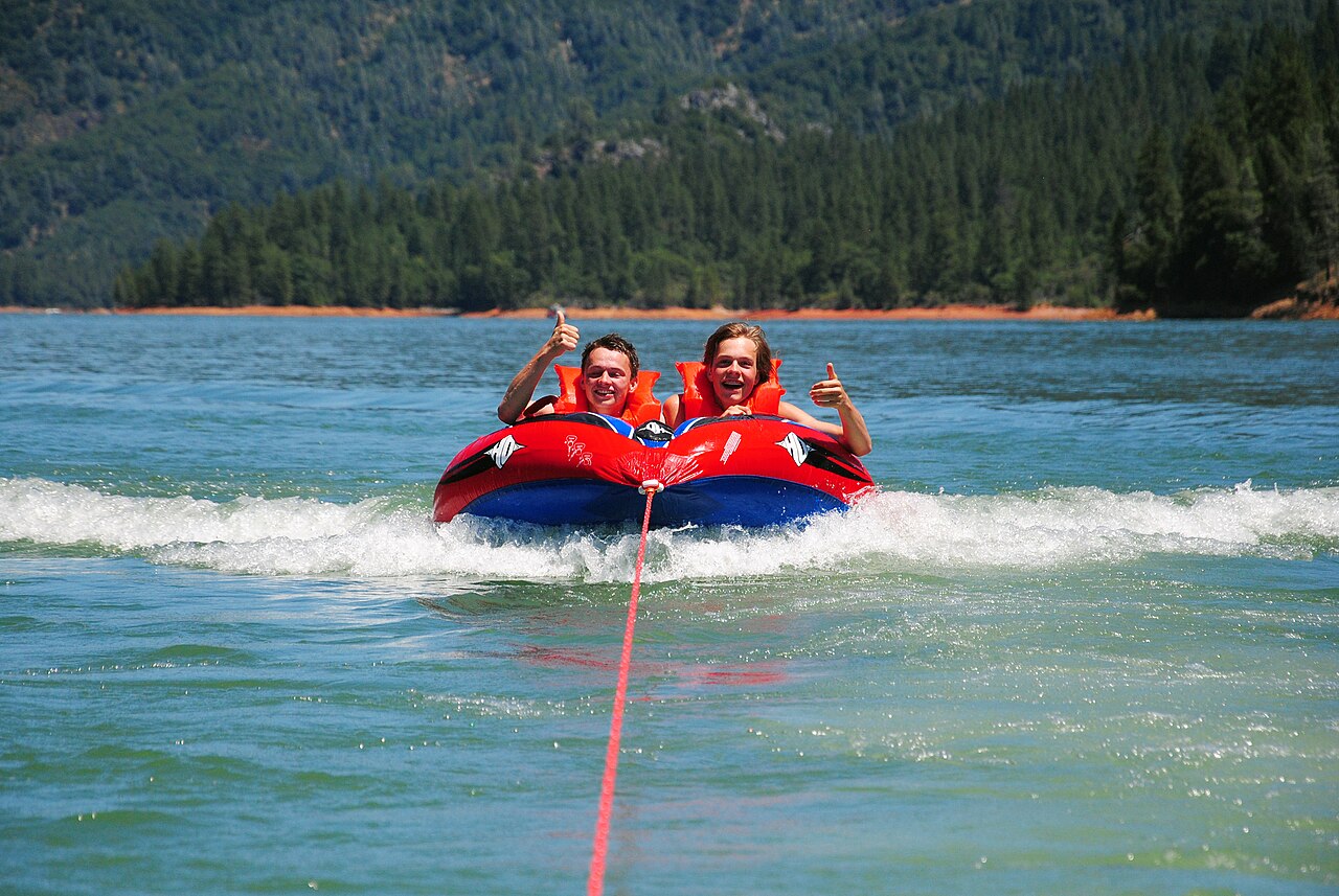 Adolescents tubing behind a motorboat, Shasta Lake, 2011, illustrative activity photo